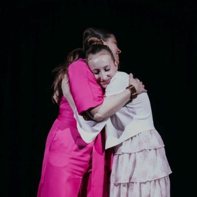 Christina and Lyric hugging after a recital.